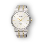 Ezüst és arany színű karóra, fehér számlappal és arany mutatókkal, SEIKO Premier felirattal, klasszikus, elegáns megjelenés.