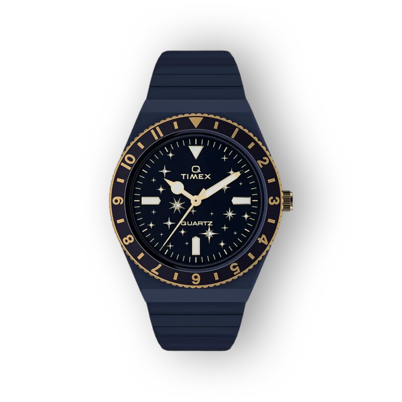 Sötétkék óraszámlap, arany színű mutatók és keret, gumis pánt, csillagmotívumokkal díszítve. Timex quartz óra.