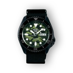 Seiko 5 Sports watch with a camouflage dial, luminous markers, black bezel, and strap, featuring date and day displays.