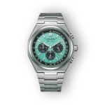 Titanium watch featuring a mint green textured dial, dark sub-dials, silver hour markers and hands, and a brushed metal band.